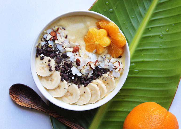 A nourishing citrus smoothie bowl made with Navitas Organics immune-boosting superfoods