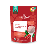Package of Navitas Organics 8oz Pomegranate Powder featuring the product's branding, nutritional claims, and an illustration of pomegranates and a scoop of the powder.