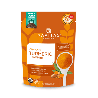 A package of Navitas Organics Superfoods Turmeric Powder, featuring a USDA Organic and Non-GMO Verified seal, with an image of a spoonful of turmeric and a plant-based icon on the front.
