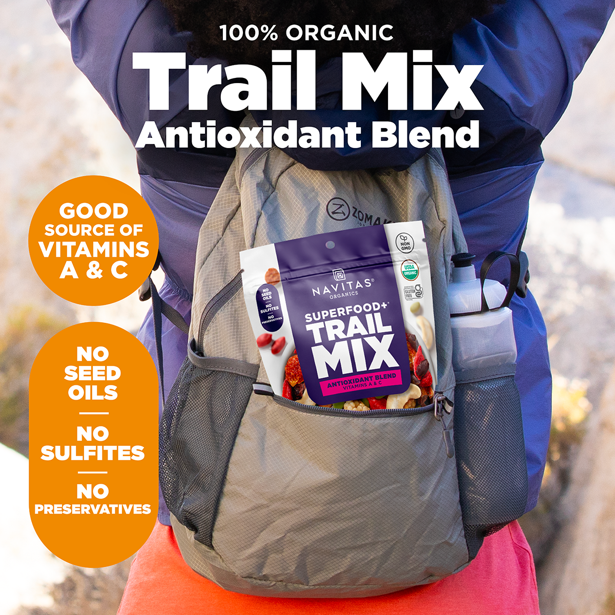 Person wearing a backpack with Navitas Organics Superfood+ Trail Mix Antioxidant Blend, set against a natural outdoor background.