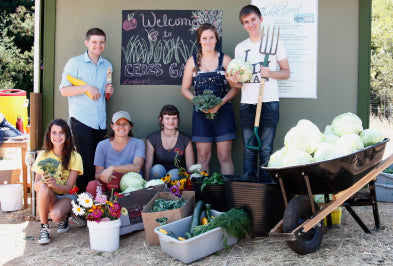 Group of students with gardening tools
