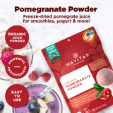 Promotional image for Navitas Organics Pomegranate Powder, featuring the product packet alongside glasses of smoothie and scattered pomegranate seeds and blueberries. Bullet points highlight the product as organic, rich in antioxidants, and easy to use.
