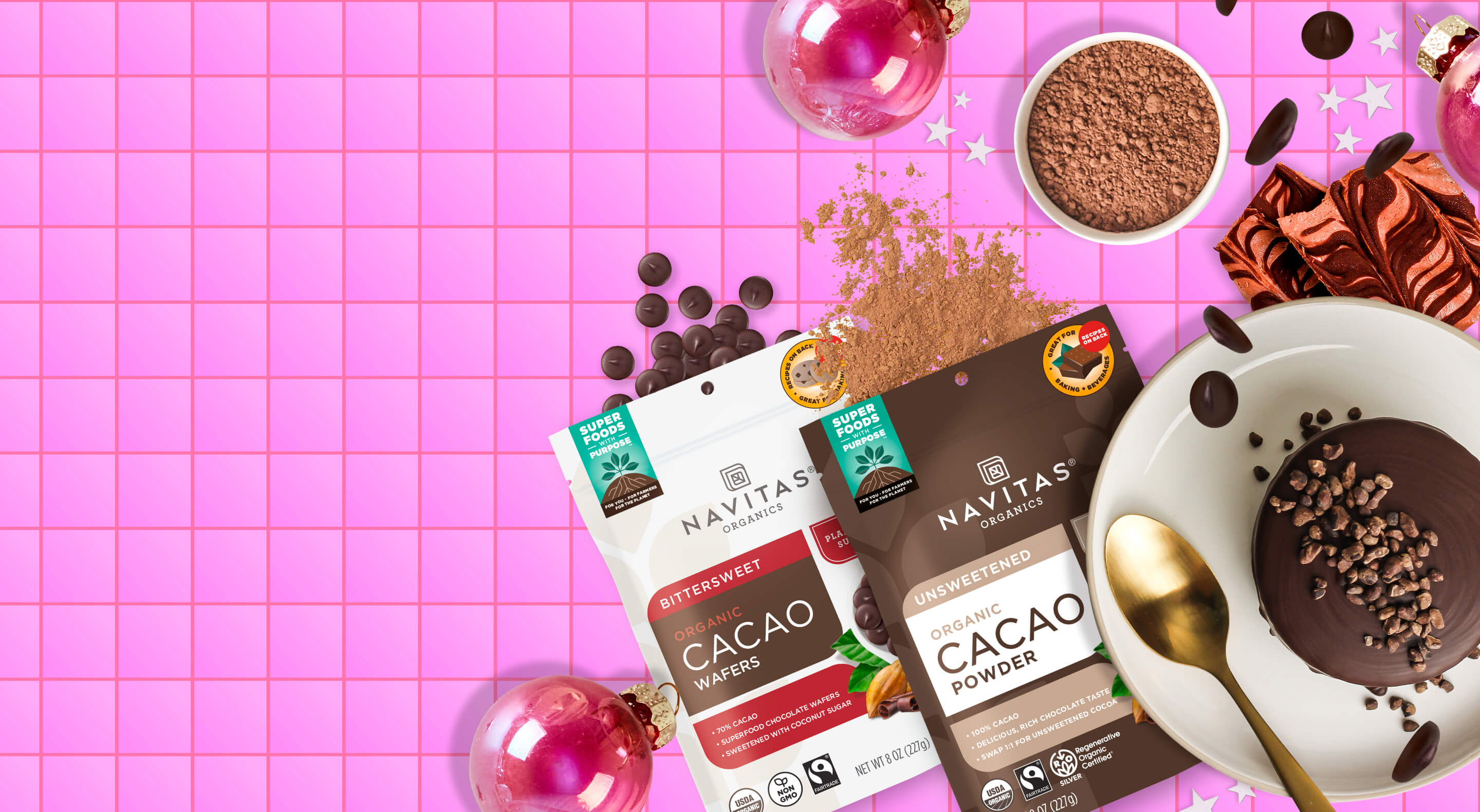 Navitas Organics Cacao Powder and Bittersweet Cacao Wafers with chocolate treats against a holiday themed background