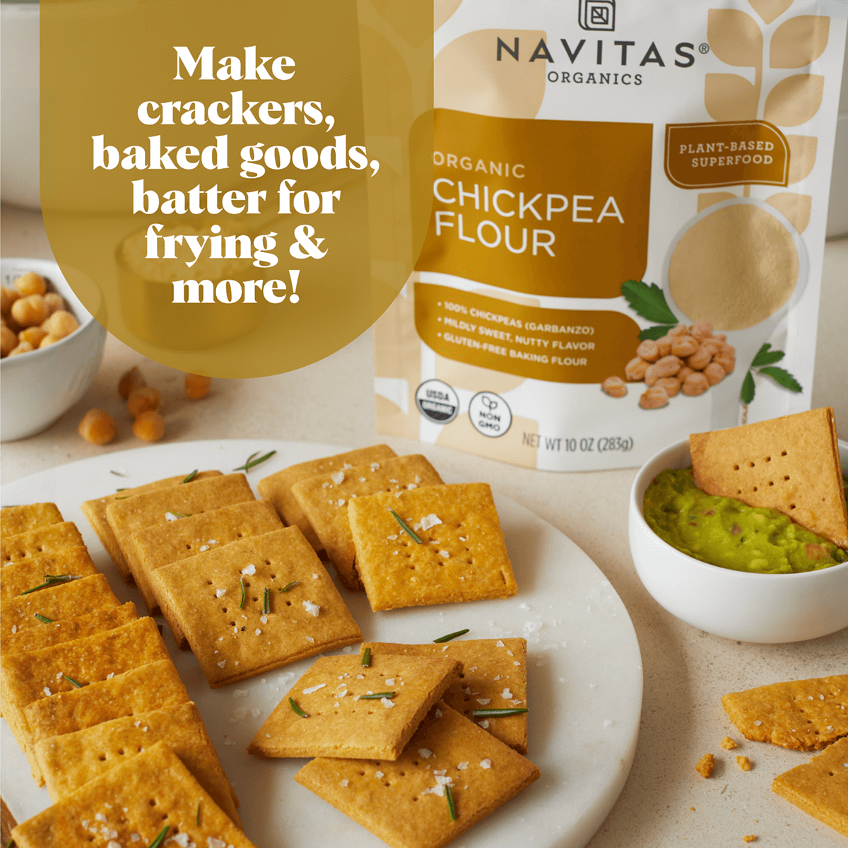 Navitas Chickpea Flour makes crackers, baked goods, batter for frying & more! Plate of homemade chickpea crackers with a bowl of guacamole and fresh chickpeas on a counter.