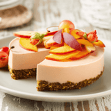 Nutritious Cheesecake made with Navitas Goji Powder and topped with fresh fruit and flowers.